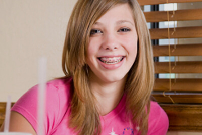 young girl with braces