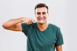 brushing and flossing with braces