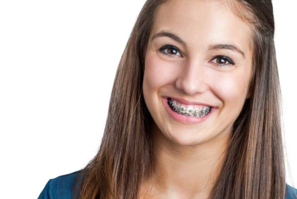 Teen With Braces Aura Orthodontics