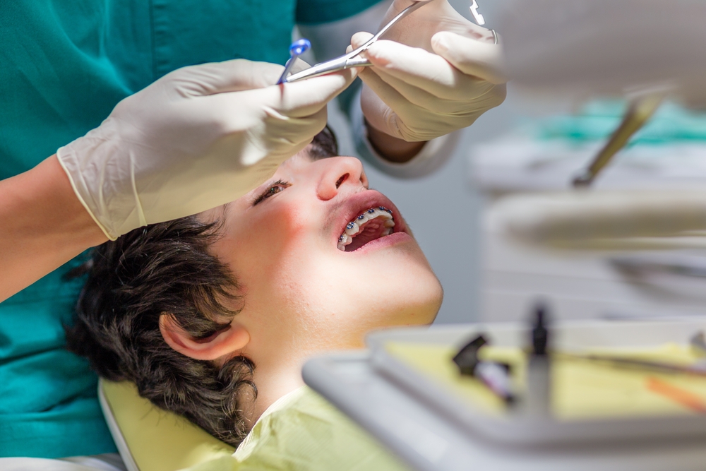 Orthodontist and patient in chair Aura Orthodontics