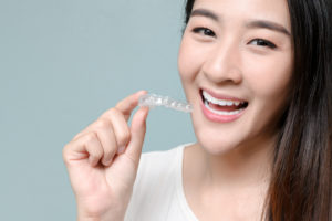 girl with aligners