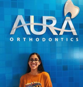 smiling Girl with Aura orthodontics wall